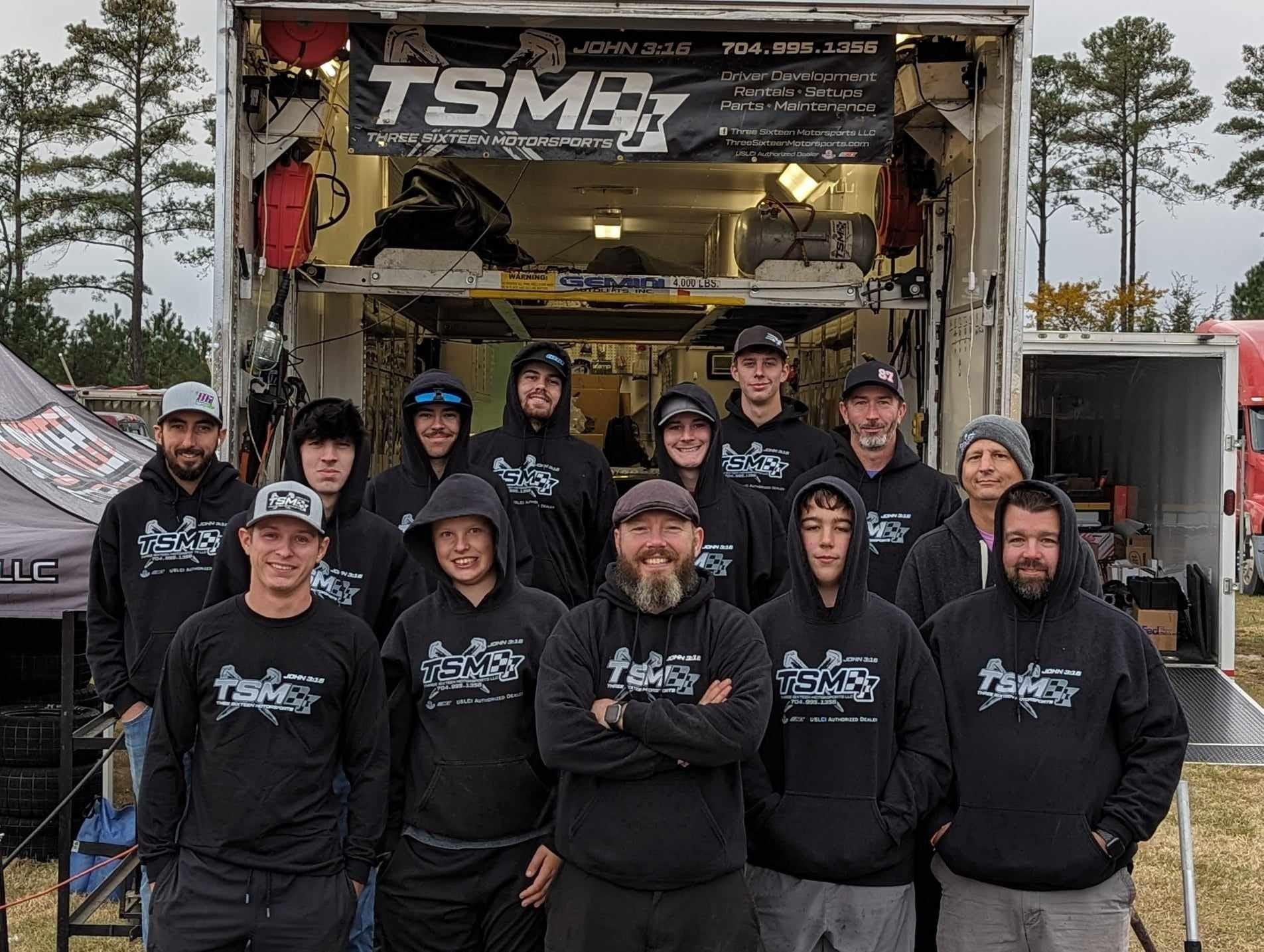 three sixteen pit crew in matching hoodies