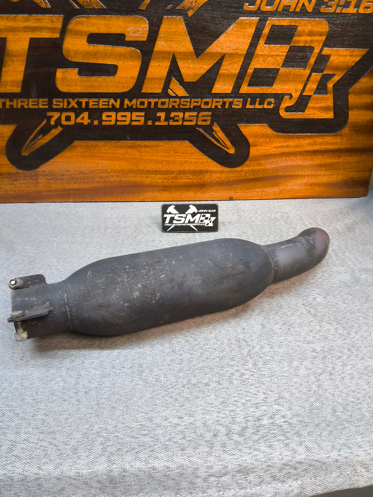 Used black metal muffler